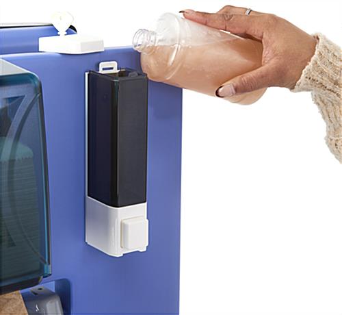 Double-sided hand washing sink with a refillable soap dispenser 