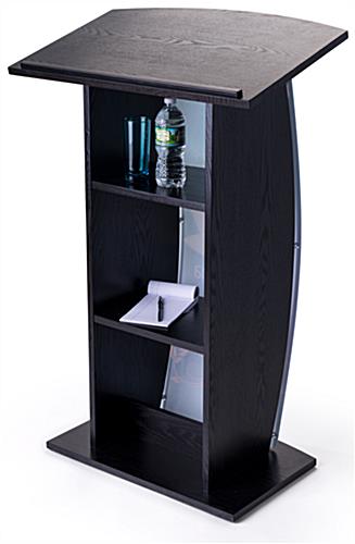 Contemporary curved lectern with custom panel and shelves for presentation essentials