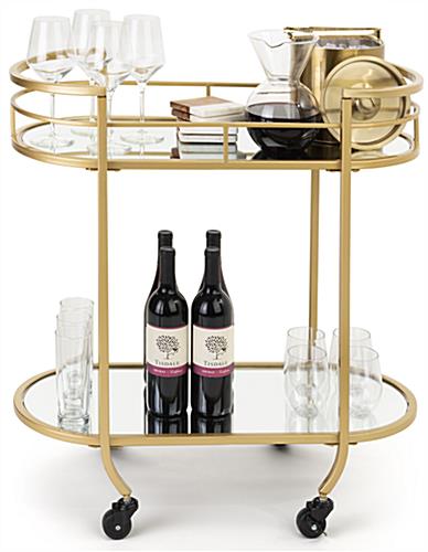 Oval serving cart on wheels with glam and art deco design aesthetic 