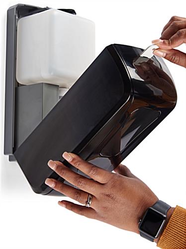 Hand sanitizer drip tray dispenser offers a locking latch