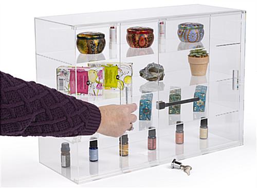 Jewelry display case with locking sliding doors