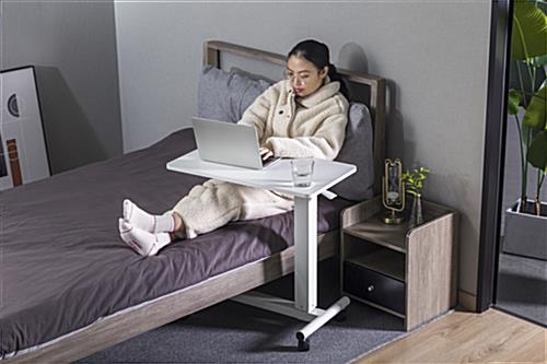 Overbed bedside table with wheels is the perfect workstation 