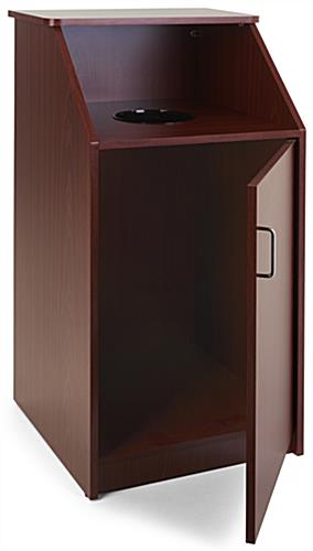 Top drop waste receptacle with tray storage 