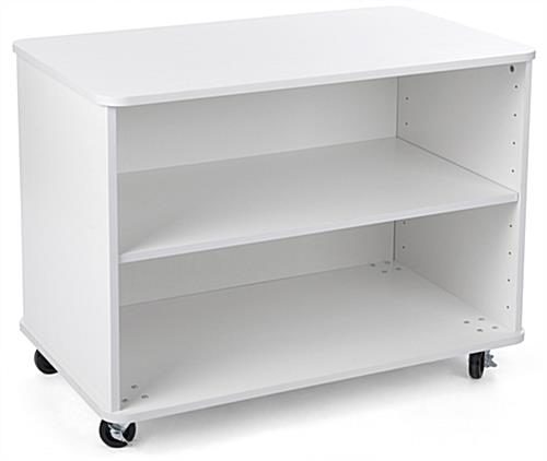 Nesting white wood display shelves for folded clothing