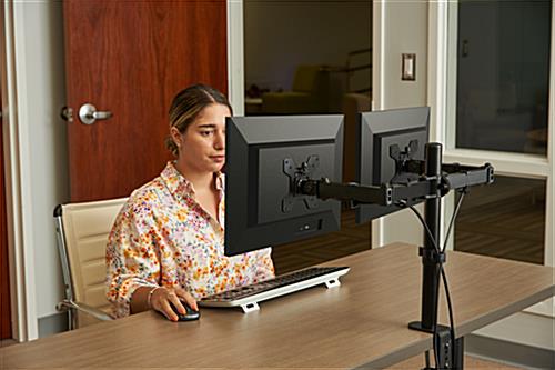 Dual monitor articulating desk mount is ideal in offices 