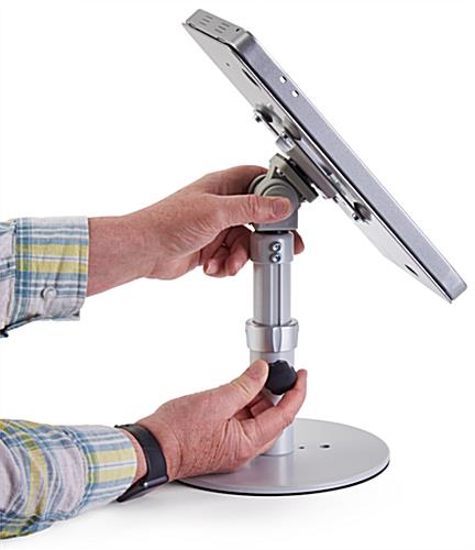 Silver adjustable countertop iPad stand that tilts to landscape or portrait mode