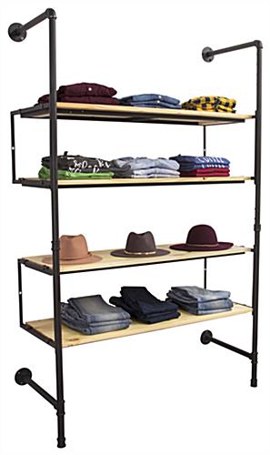 Industrial Pipe Shelving Wall Unit Showcasing Hats and Clothing