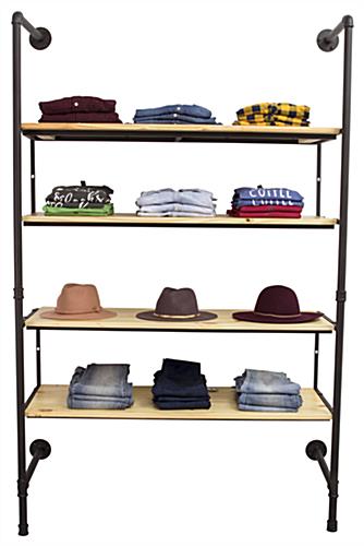 Industrial Pipe Shelving Wall Unit Displaying Folded Clothes