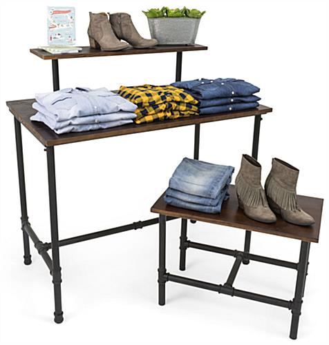Set of Pipe Display Nesting Tables Showcasing Pants and Shirts