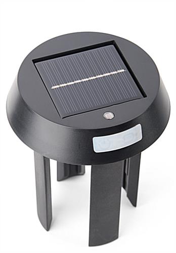 Stanchion mount LED light with solar charging capabilities
