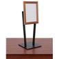 Striking countertop snap frame with black base and faux wood oak finish