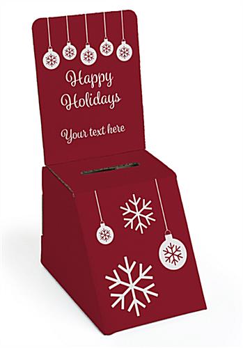 Seasonal cardboard donation bin with holiday graphics