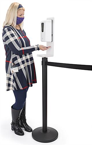 Hand sanitizer stanchion topper is battery operated