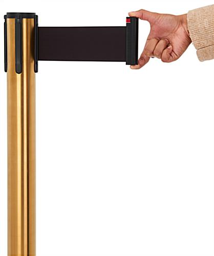 These retractable belt stanchions have 10 feet of black nylon fabric