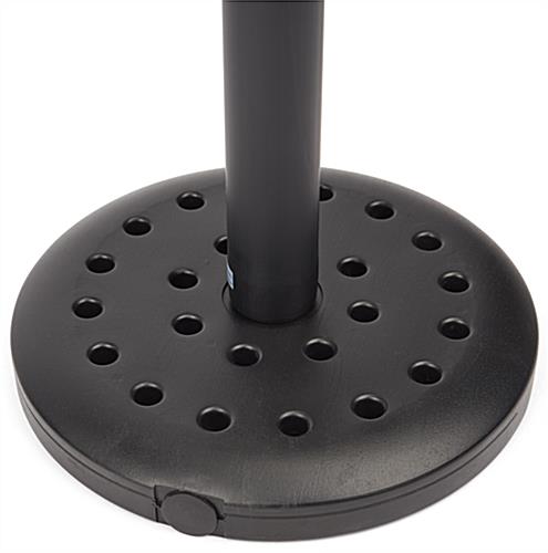 This weather resistant retractable stanchion with a weighted base