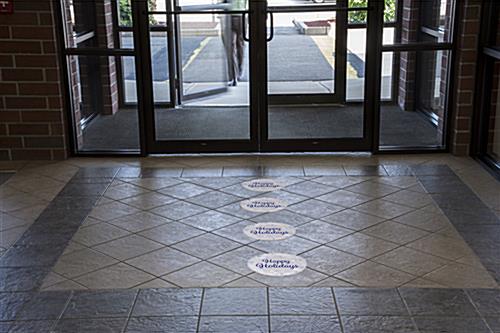 12" x 12" round "Happy Holidays" floor decal adheres to a variety of substrates