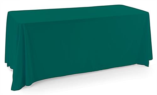 Green polyester table cover with an elegant draping display 