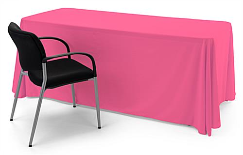Pink polyester table cover with draping display 