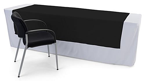 Black printed table runner is machine washable 