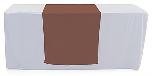 Brown table runner with with hemmed edge