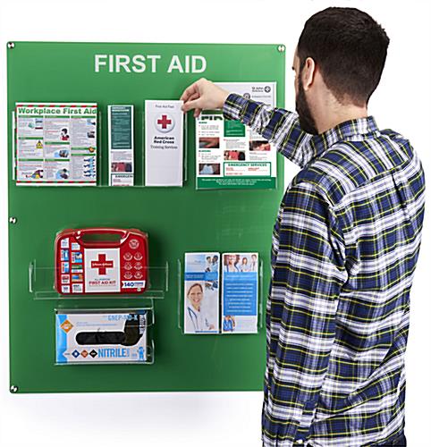 Wall-mounted first aid station shown to size scale