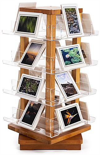 Spinning wooden literature holder includes 16 acrylic shelves 