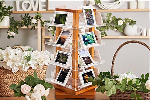 Spinning wooden literature holder with multiple tiers of clear acrylic shelving 