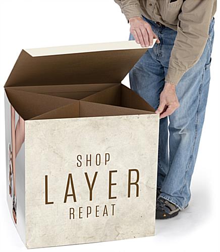 Branded cardboard display cube with five sided design and hollow bottom