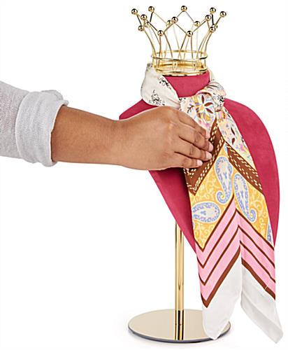 This jewelry bust display stand with crown has a pink and colorway 