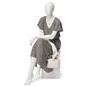 Abstract seated female mannequin with relaxed sitting pose