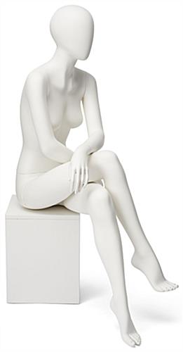 Abstract seated female mannequin with egg head design 