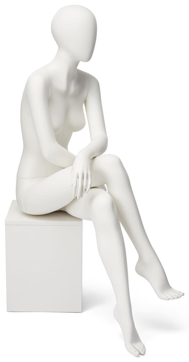 Abstract seated female mannequin with egg head design 