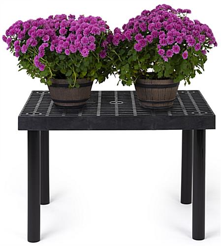 Outdoor display table with weather resistant design 