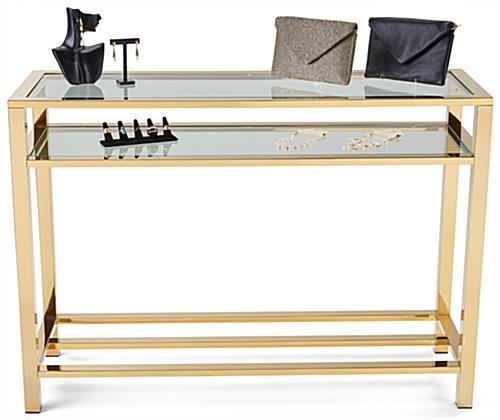 Gold and glass console table with max weight capacity of 110lbs