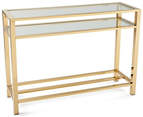 Gold and glass console table with modern mirrored gold finish