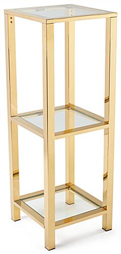 Narrow etagere with glass shelves that are 16 inches by 16 inches each