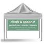 Image of a vinyl tent banner on a tent with a white canopy