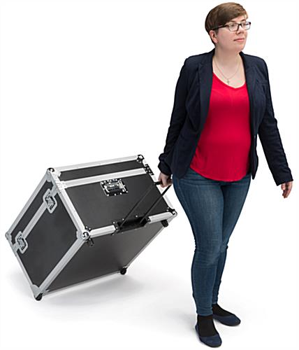 Trade show floor tile carrying case shown with extendable pull handle
