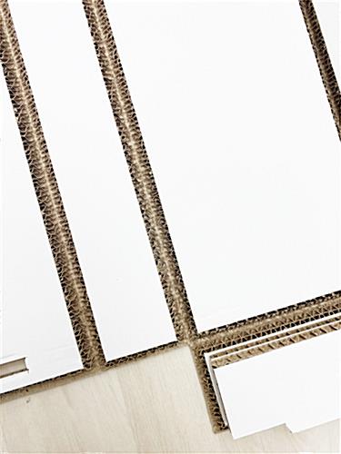 Eco-friendly booth backwall with unique v-groove cuts for simple construction 
