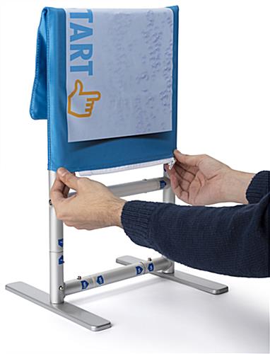 Mounted table banner sanitizer station with easily application of graphic to frame