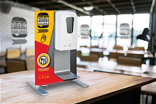 Tabletop sanitizer dispenser with banner in restaurant environment