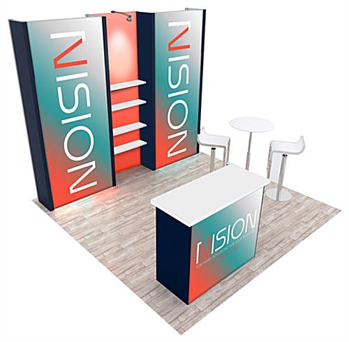 1014 10’ x 10’ Hybrid Trade Show Booth rental with two 3D backwalls with shelving in between with a podium and table and chairs in front of them