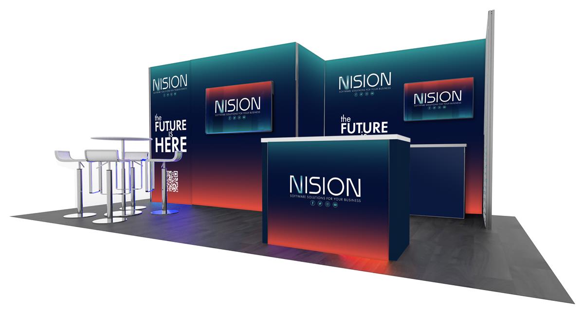 2013 20’ x 10’ Gravitee™ trade show booth rental shown from the right to show a backwall set back with two 90 degree panels from a second backwall to the left. There is a small work station in front of the recessed wall and a larger backlit counter in front of that.