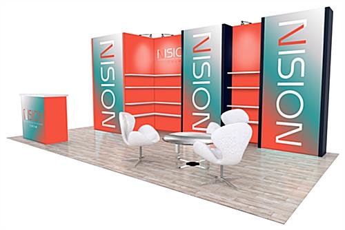 2023 20’ x 10’ Inline Trade Show Exhibit from the right showing the five backwall panels including two with shelving, a short table with three chairs, and a podium with white countertop