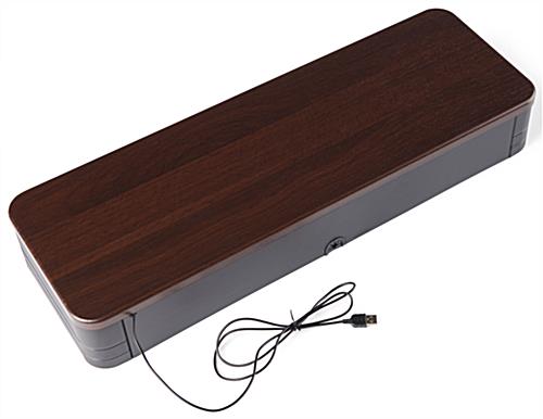 Monitor stand comes in a warm brown wood grain look top with black sides