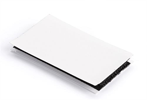 Hook and loop strips with removable film 