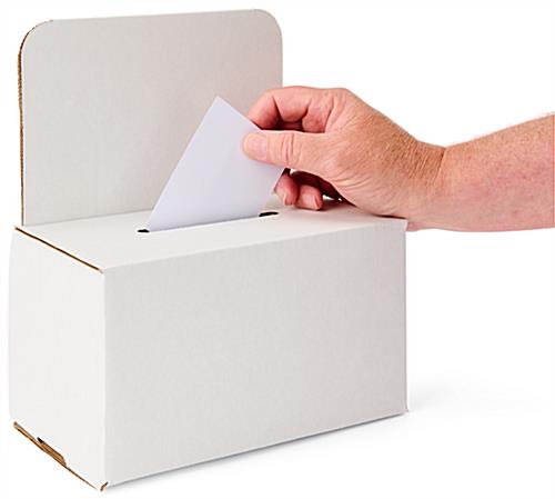 Custom cardboard enter to win box with small cutout in the top to drop in ballots