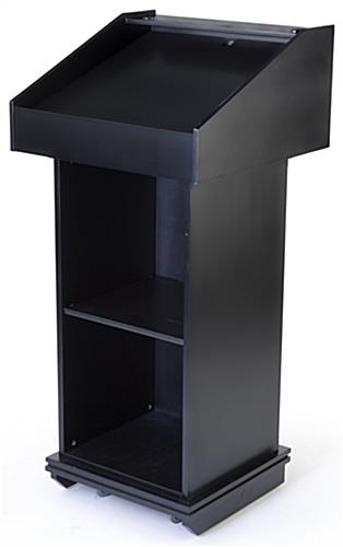 Black podium fixture with shelf and reading lip for materials 